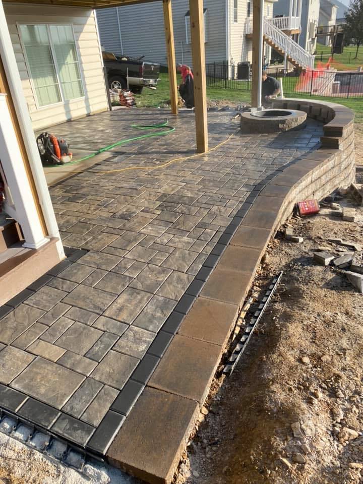 Paver walkway and outdoor feature setting by JM Outdoor Services